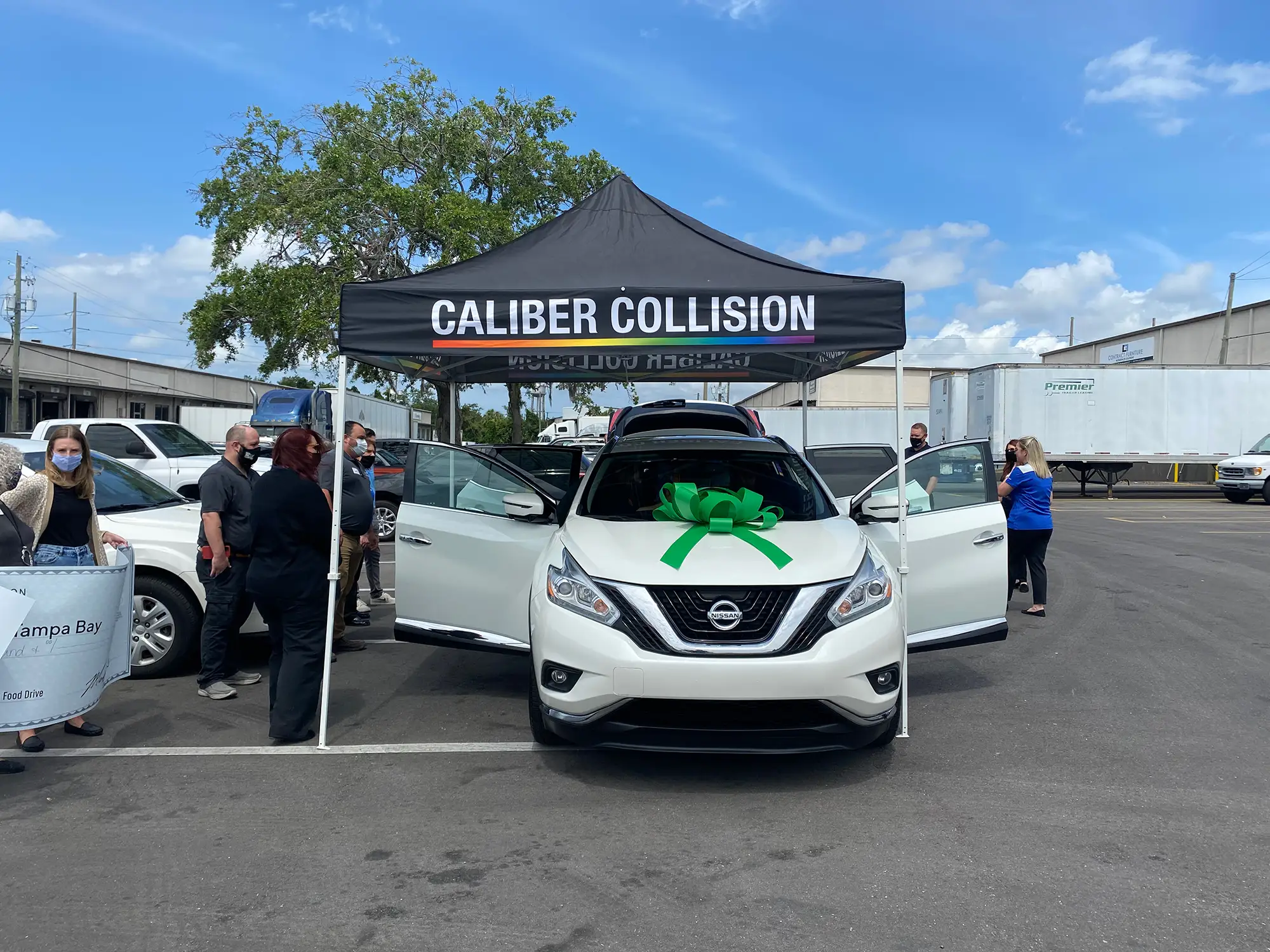 Caliber Collision preparing a restored vehicle for the NABC Recycled Rides program.